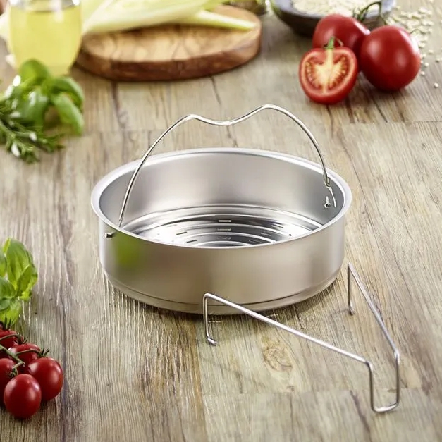 Steaming basket with tripod trivet is included