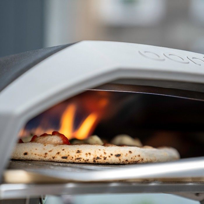 Make pizza in an Ooni Koda stone oven