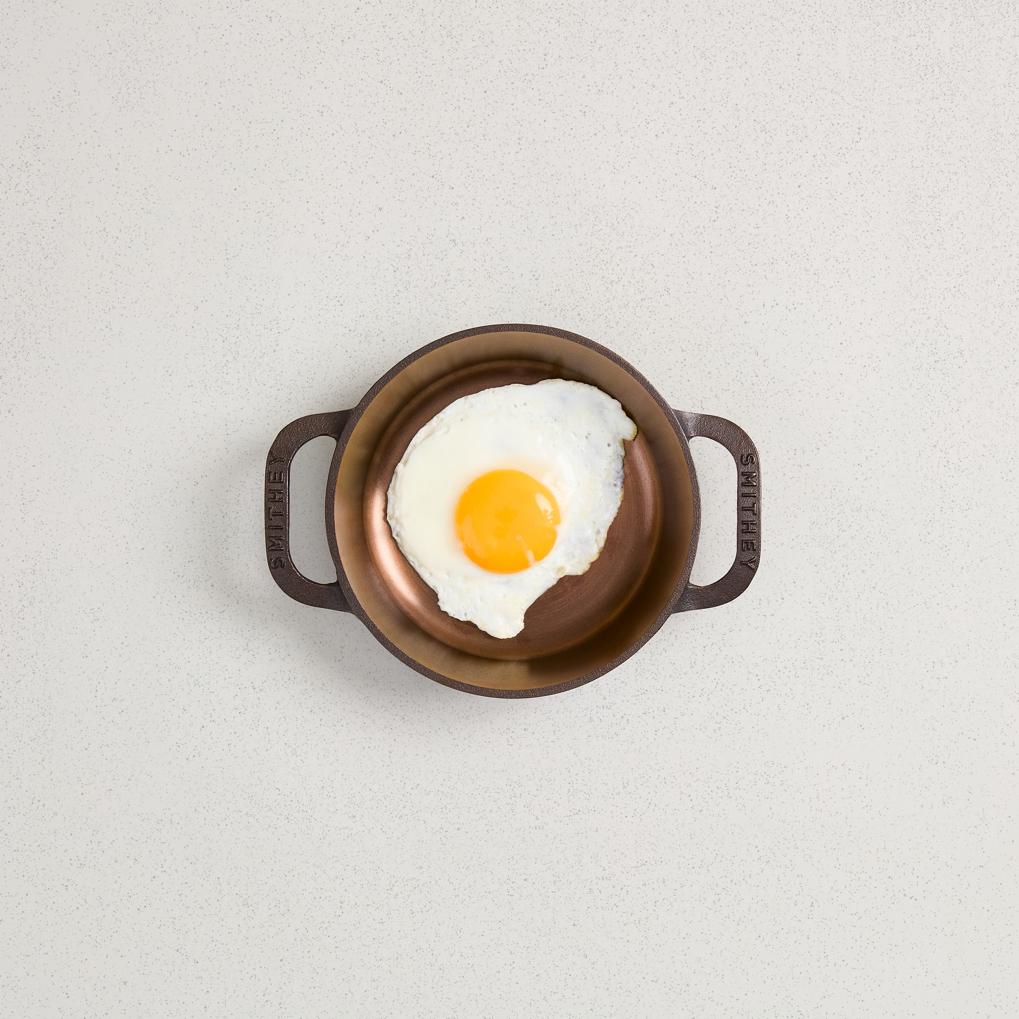 satin smooth interior cast iron skillet cooking egg