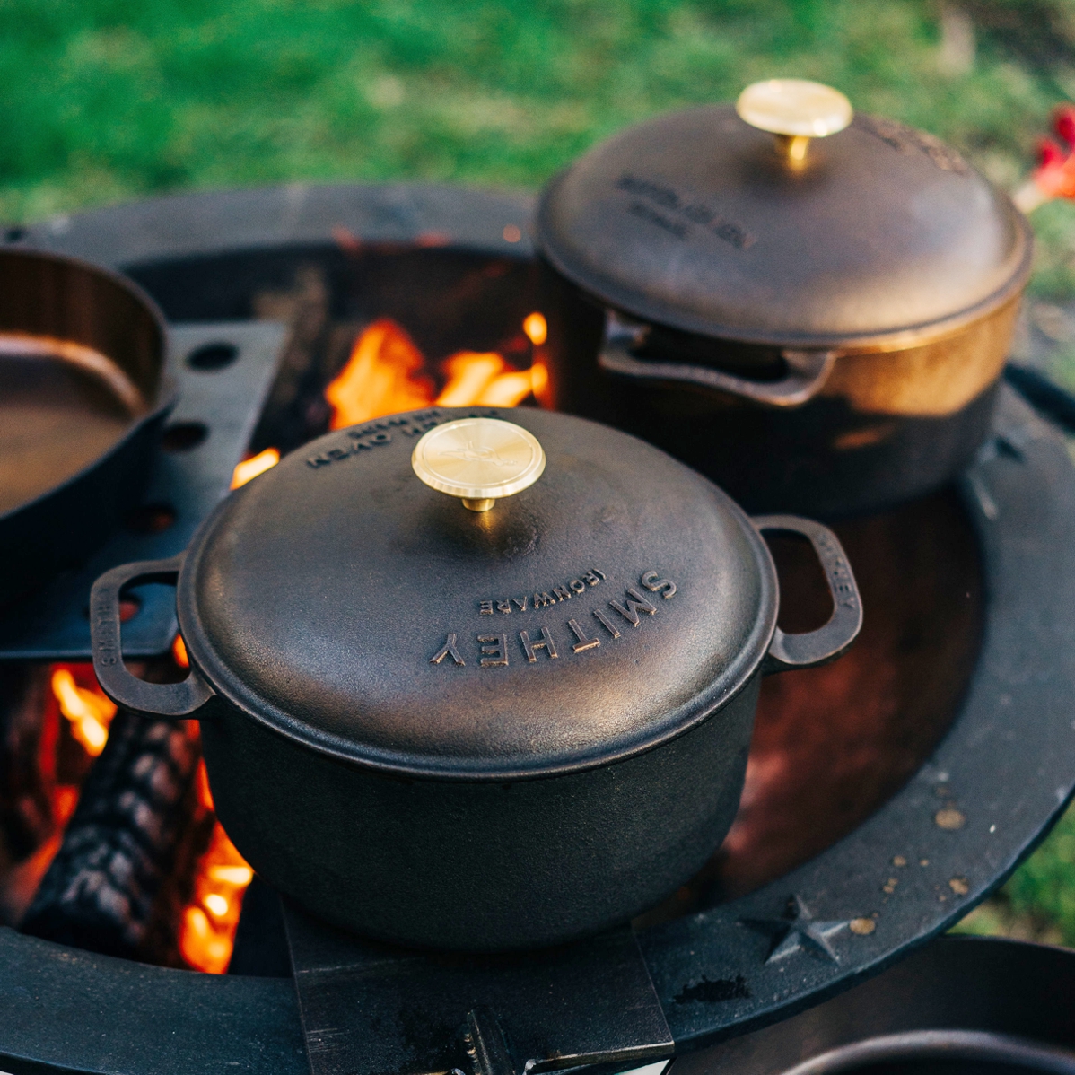 Cast iron dutch oven with lid over open fire 