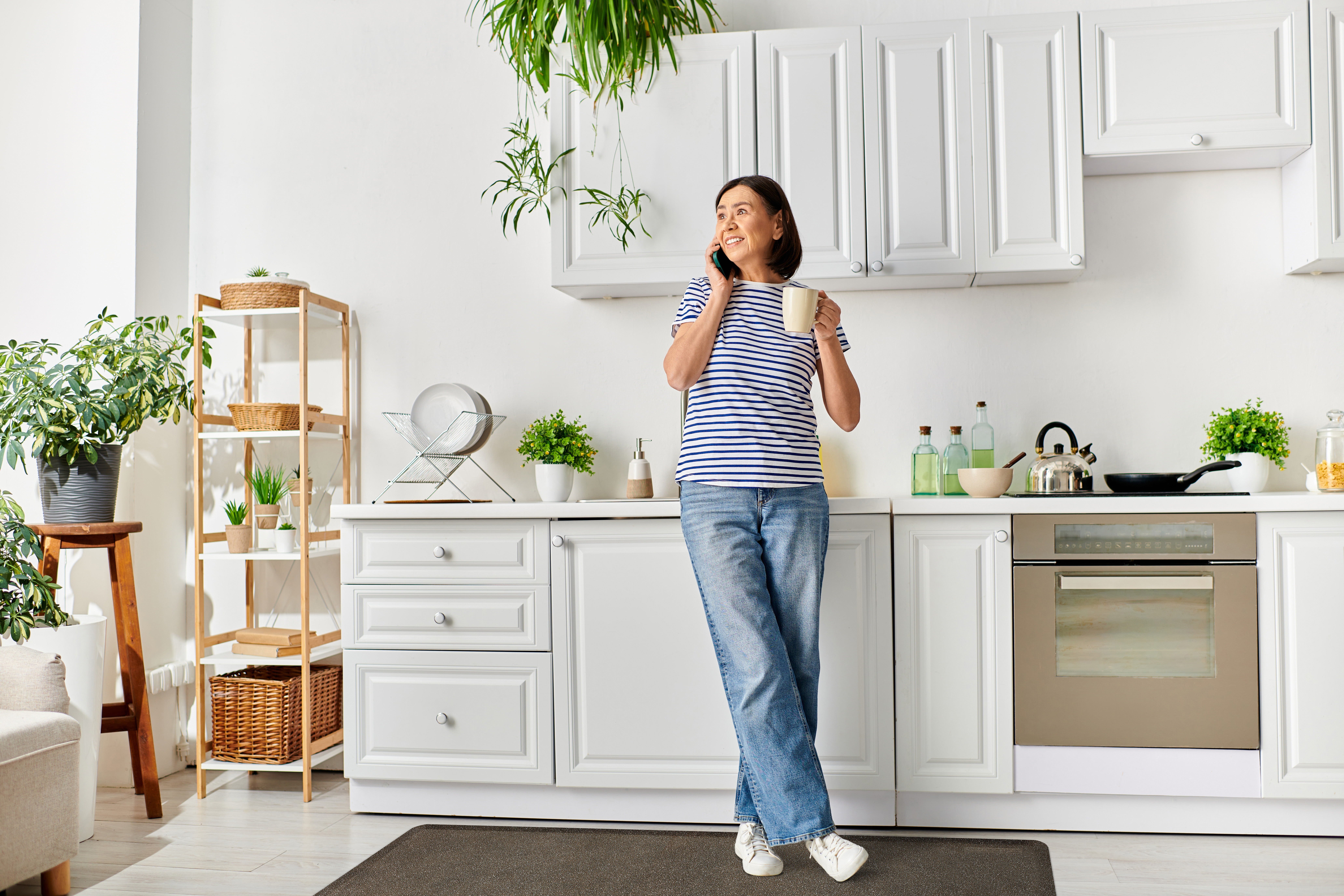 Granite Topaz wellness mat runner shown in kitchen with woman standing on it
