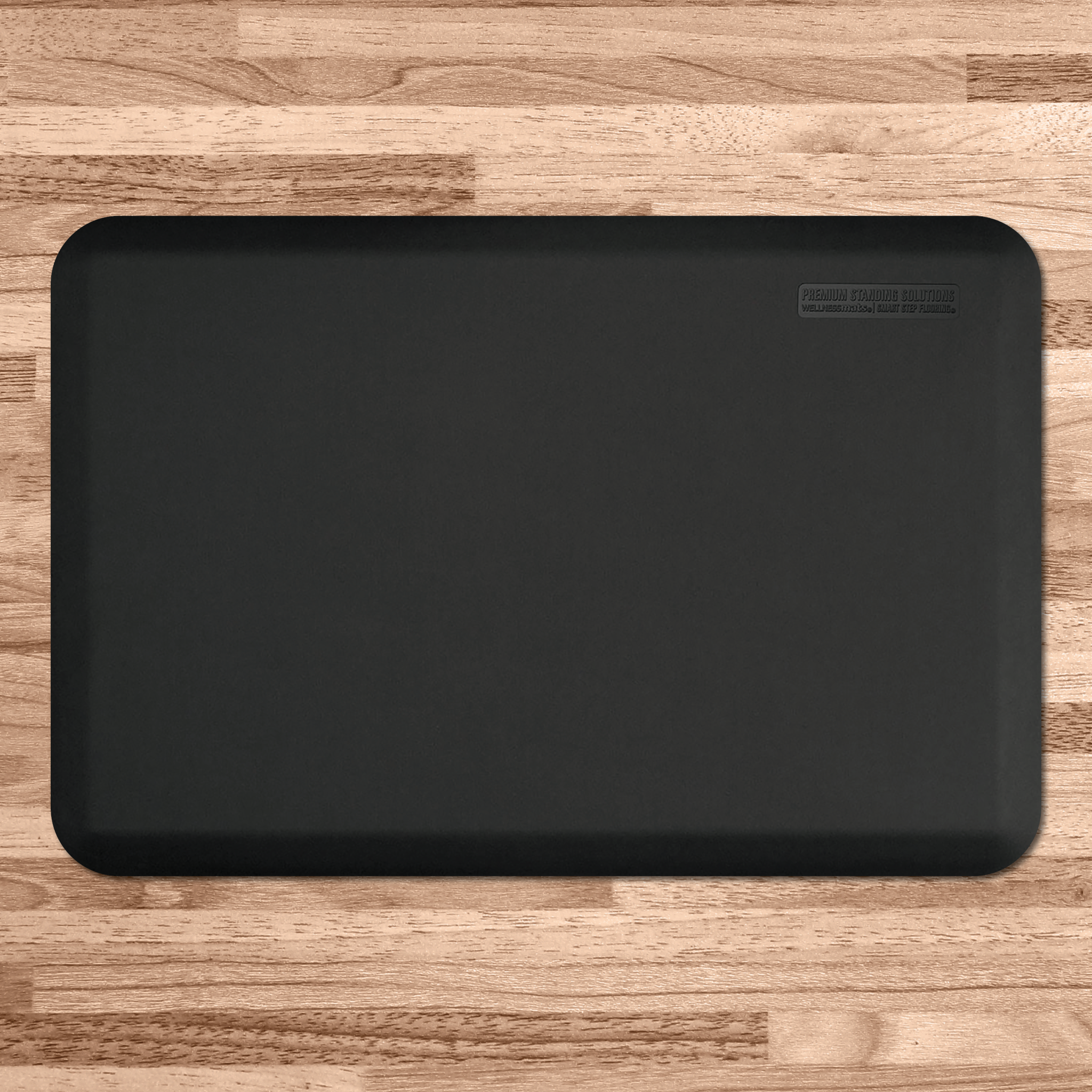 black wellness mat on wood flooring