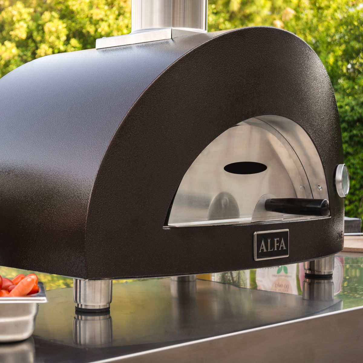 alfa pizza oven shown in outdoor kitchen