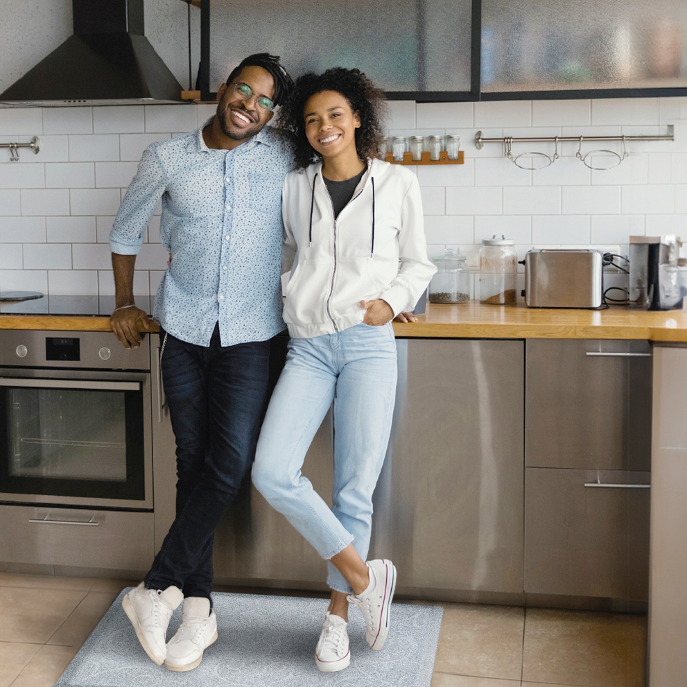 Couple standing on a Bella Granite mat