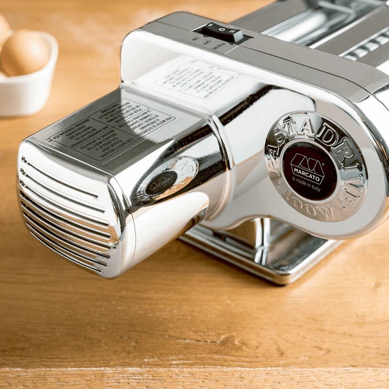 Motor drive attached to pasta machine