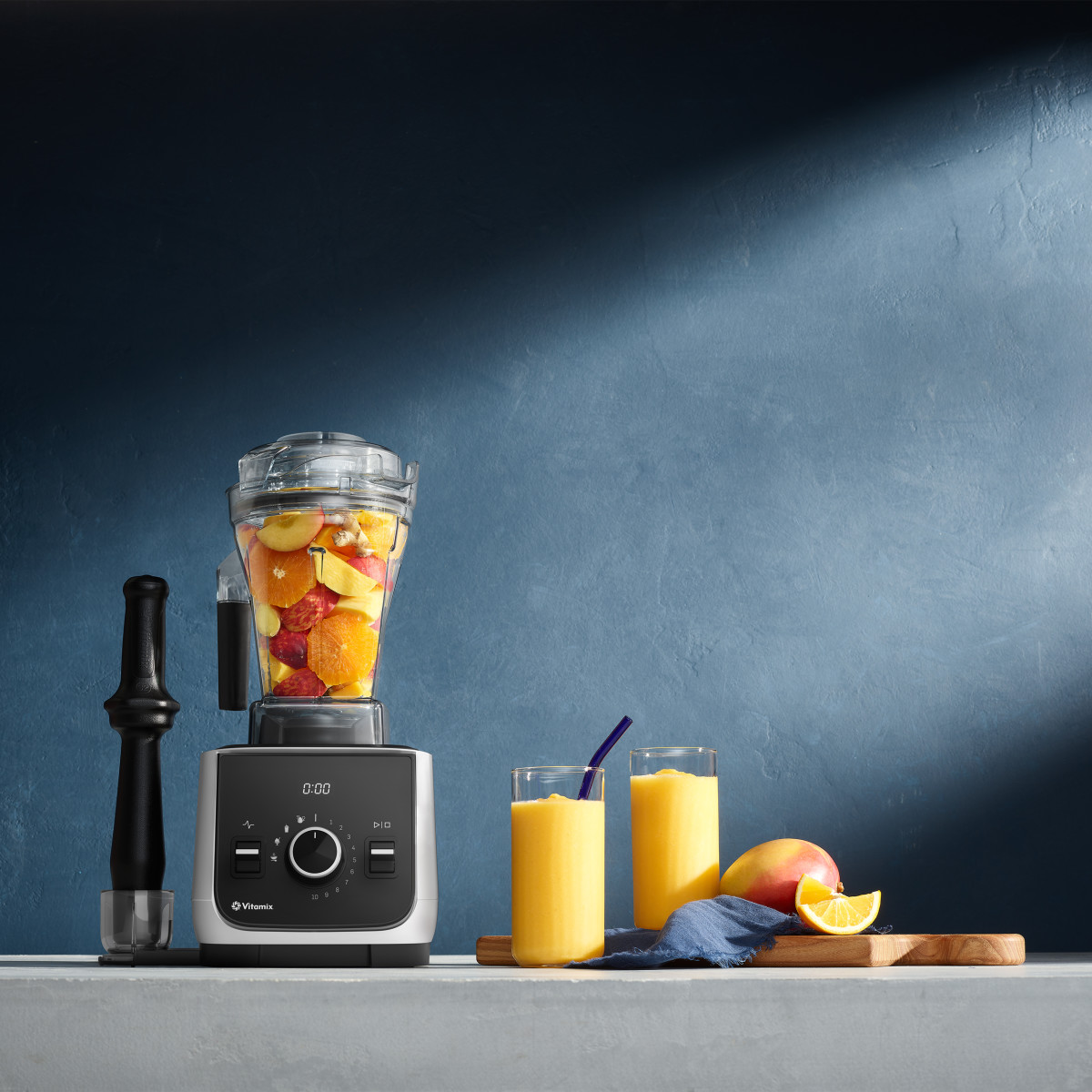 vitamix ascent x2 staged with fruit and two glasses with smoothies