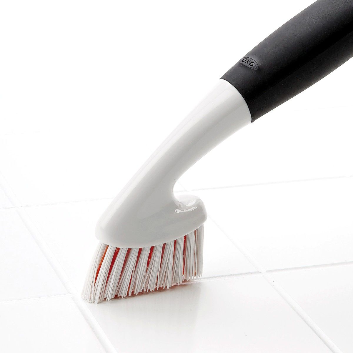 Grout scrubbing demonstration by OXO Good Grips grout brush.