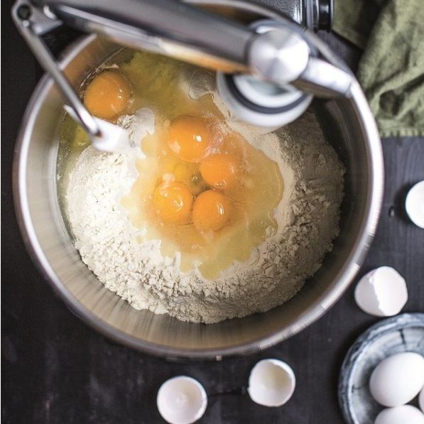 Mixing pasta dough in stainless bowl 