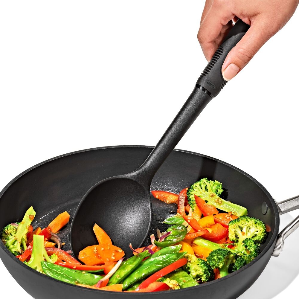 Oxo Nylon serving spoon scooping grilled vegetables