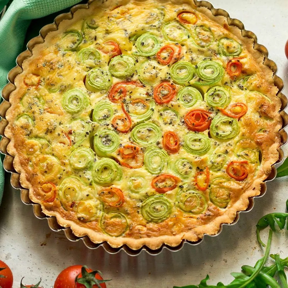 norpro quiche pan with vegetable quiche in it