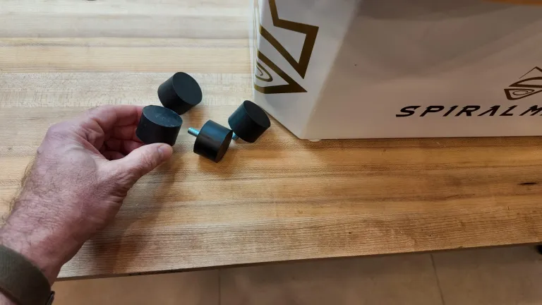 null The four rubber feet I needed to attach to the machine. The feet you get with your machine might be a little shorter and thinner, but will accomplish the same thing. Casters are an option.