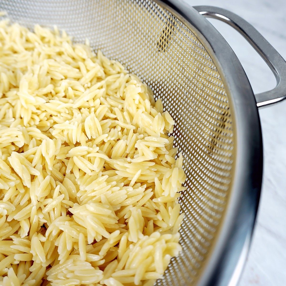 Rice in RSVP stainless colander