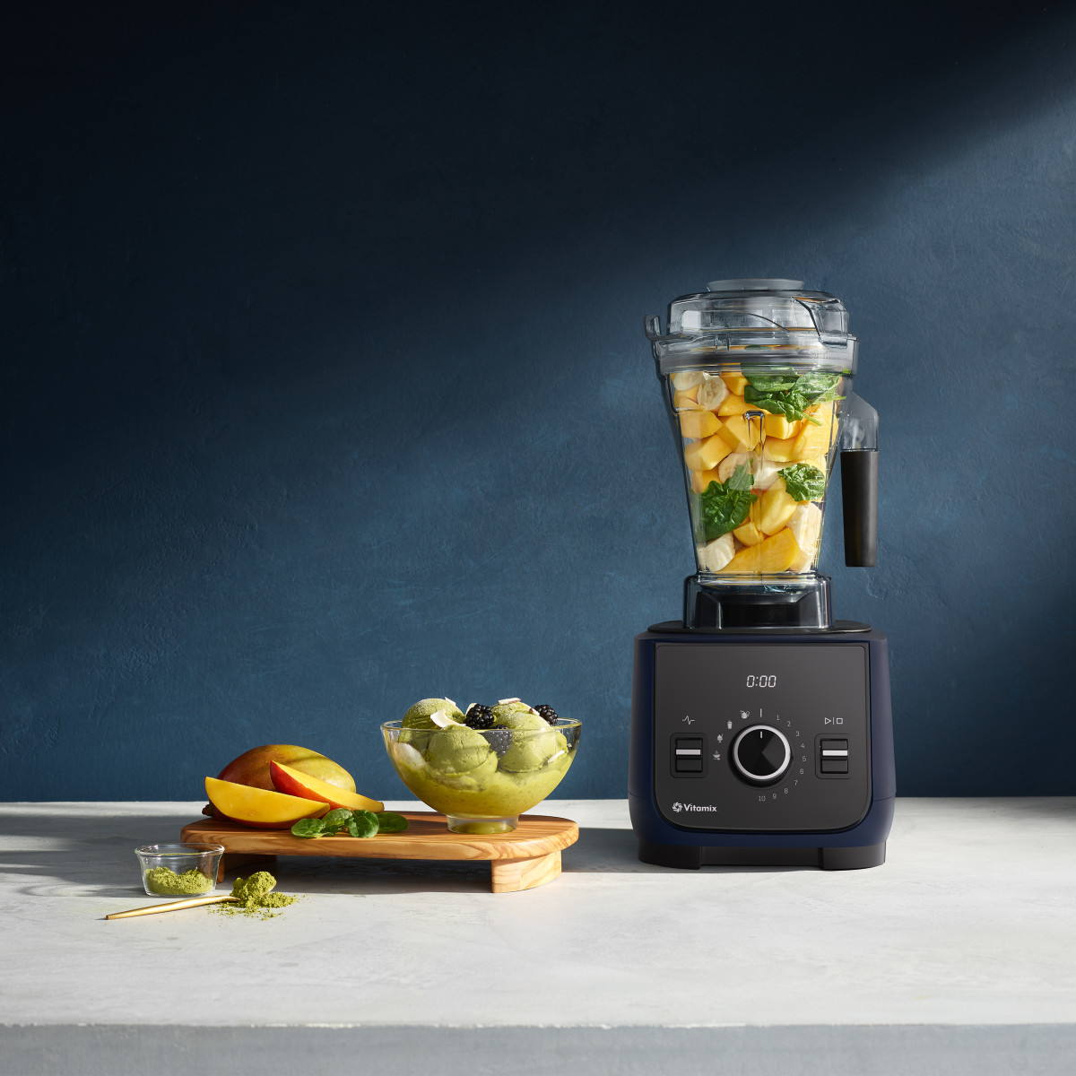 vitamix ascent x2 in frost white filled with fruit and vegetables