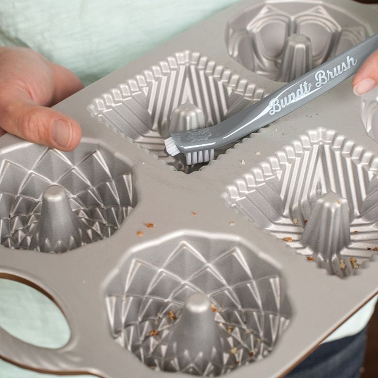 Cleaning intricate bakeware w/Nordic Ware brush