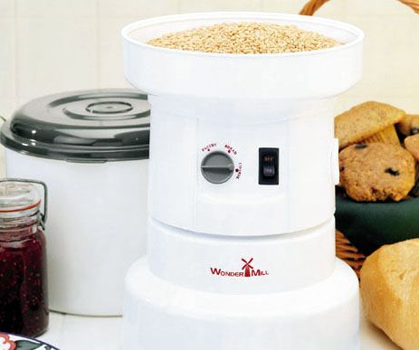The Wondermill high speed home grain mill with wheat in hopper.