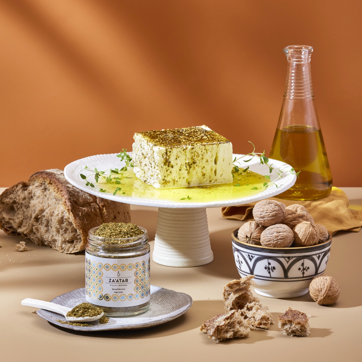 Tofu on cake stand seasoned with olive oil and zaatar