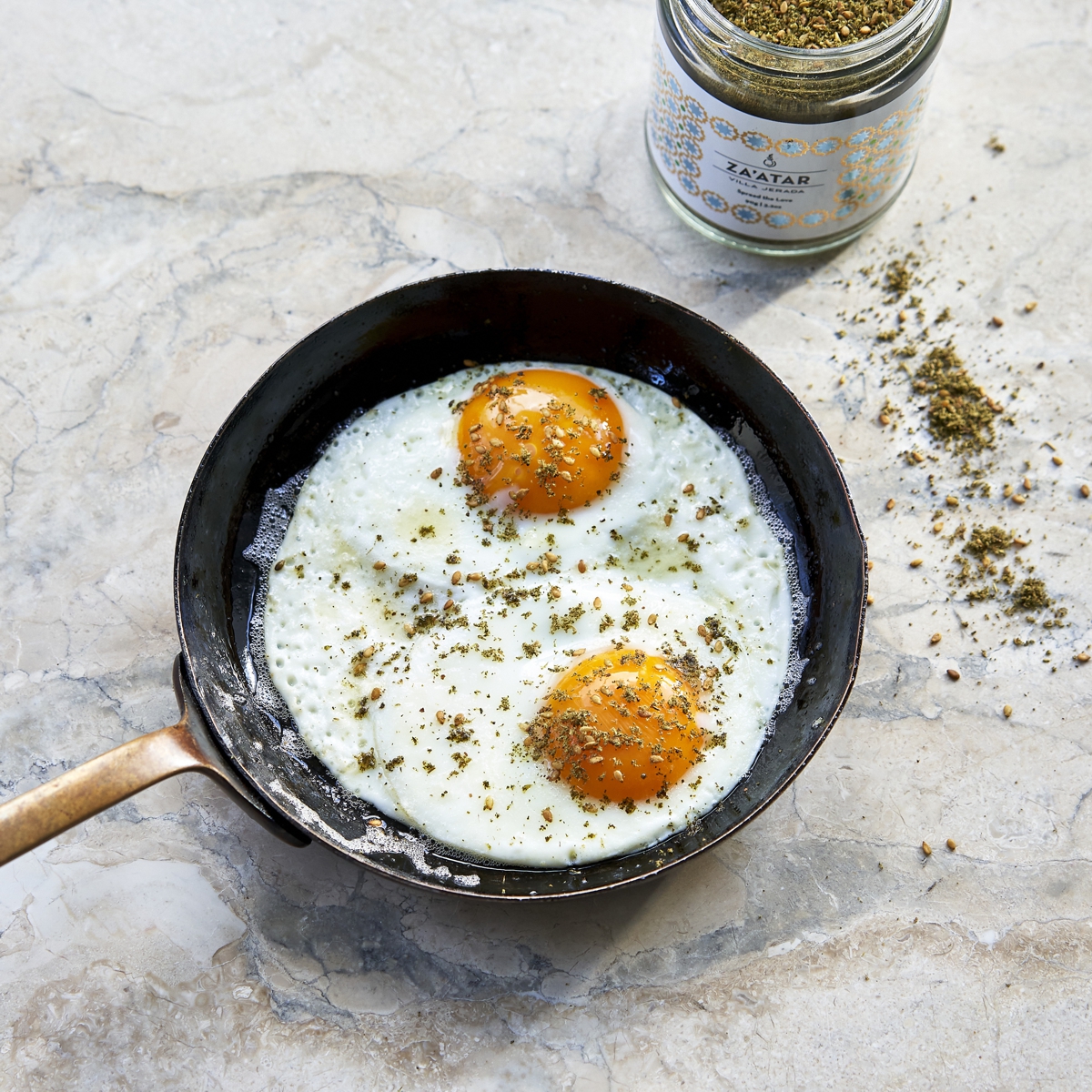 Skillet with fried eggs seasoned with zaatar