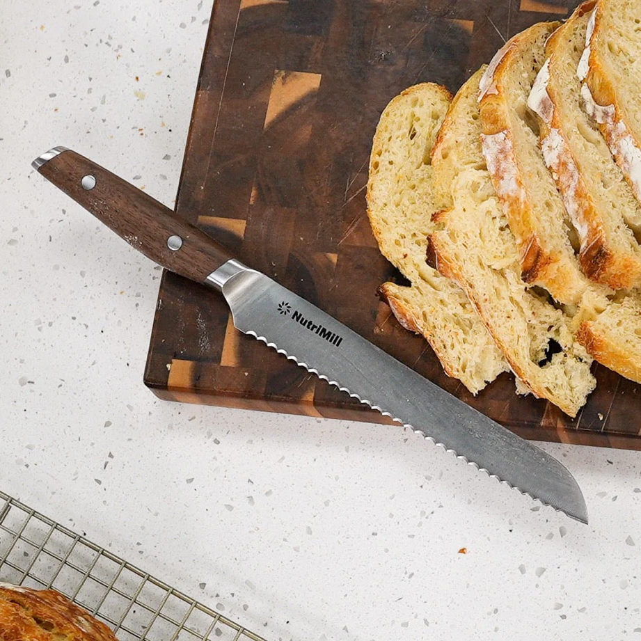 nutrimill bread knife shown by loaf of bread