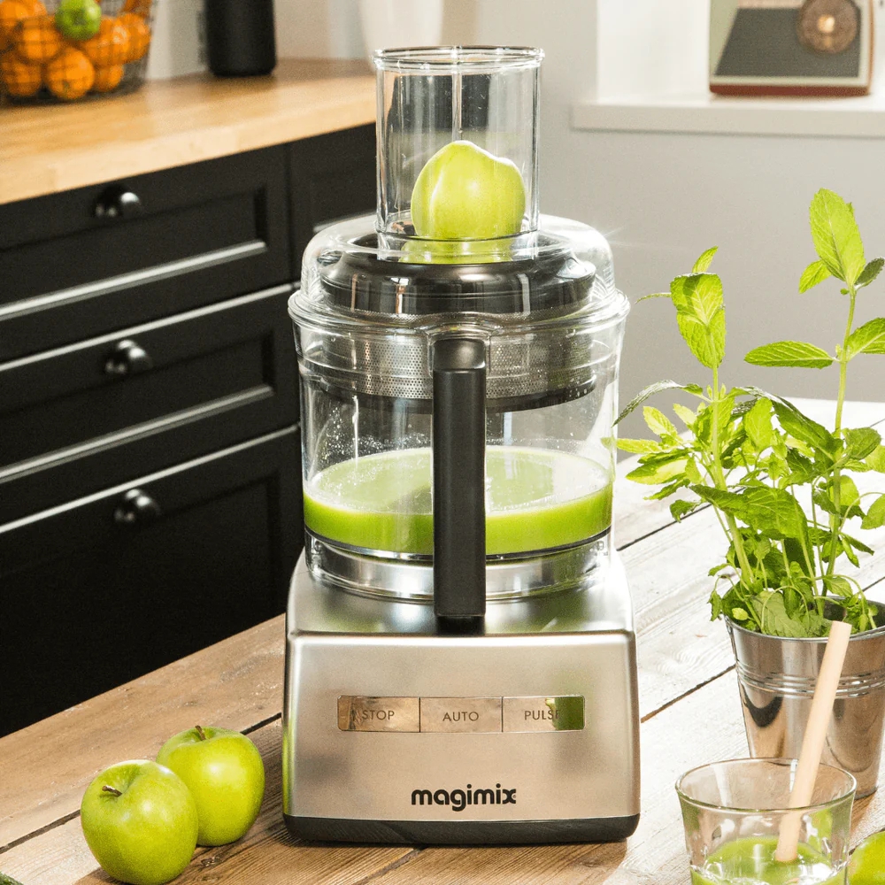 magimix juicer attachment shown on food processor juicing green apples