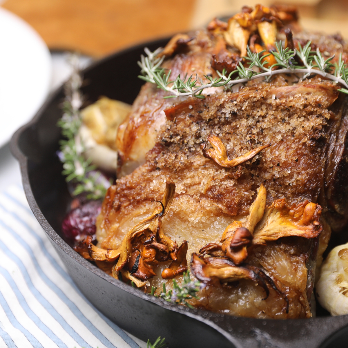 Cast iron frying pan with roast and vegetables