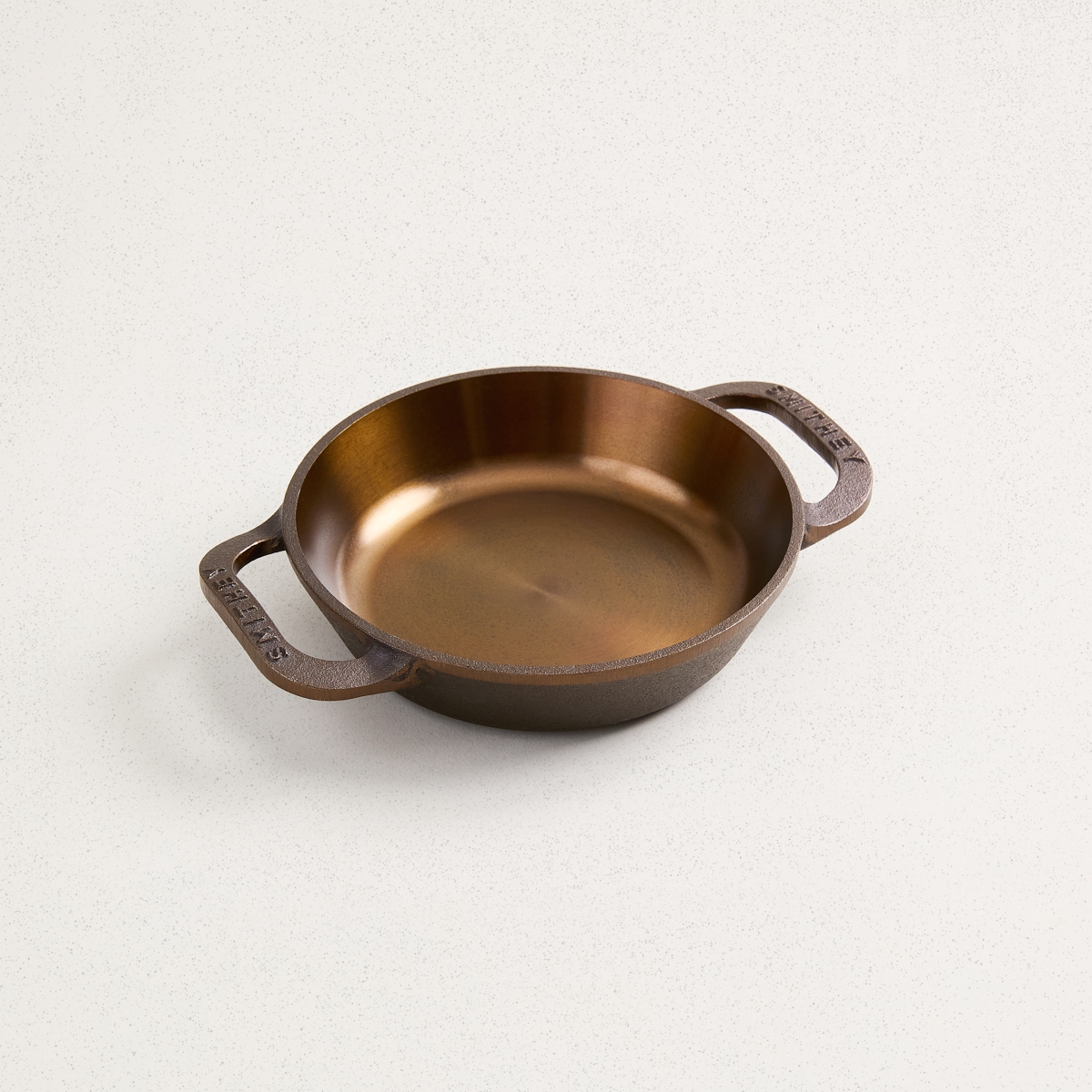 smooth interior of 6 inch dual handle cast iron skillet