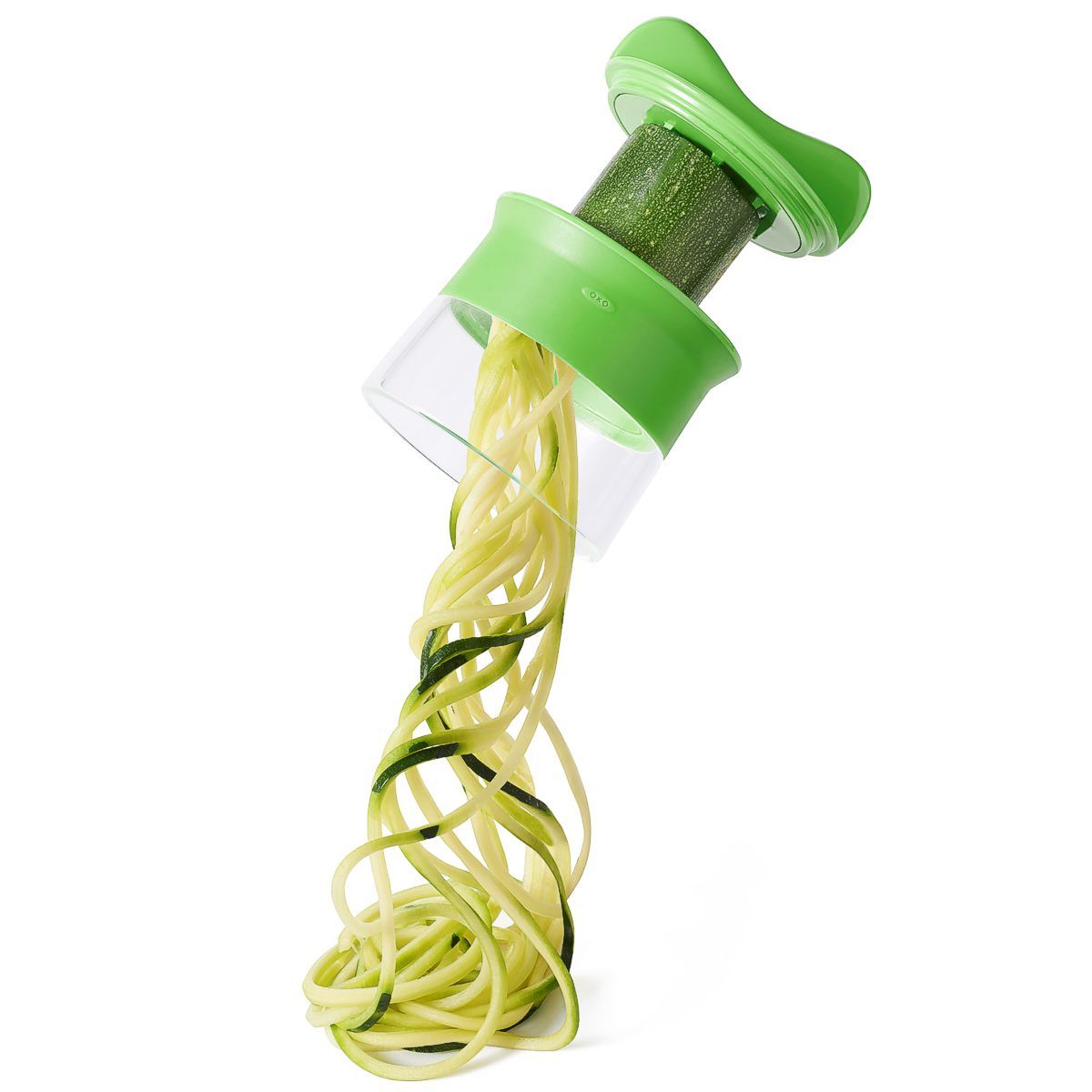OXO Good Grips hand held spiralizer slicing a cucumber with handle twister.