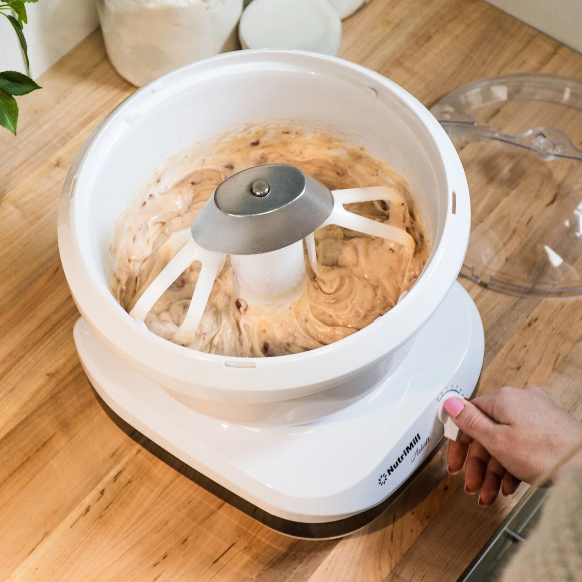 NutriMill Artiste cake paddles shown mixing cookie dough