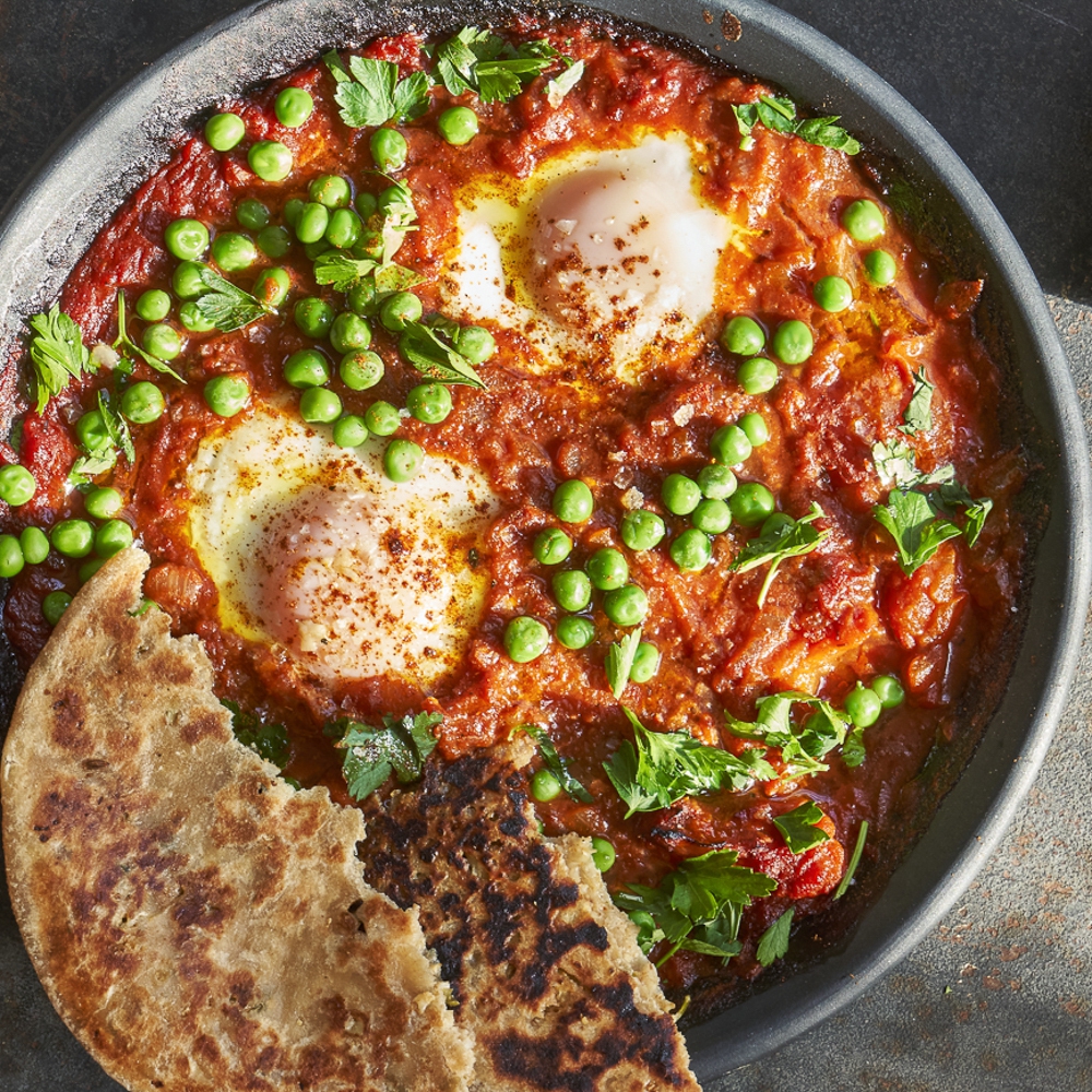Plate of season eggs and vegetables with Shaksuka
