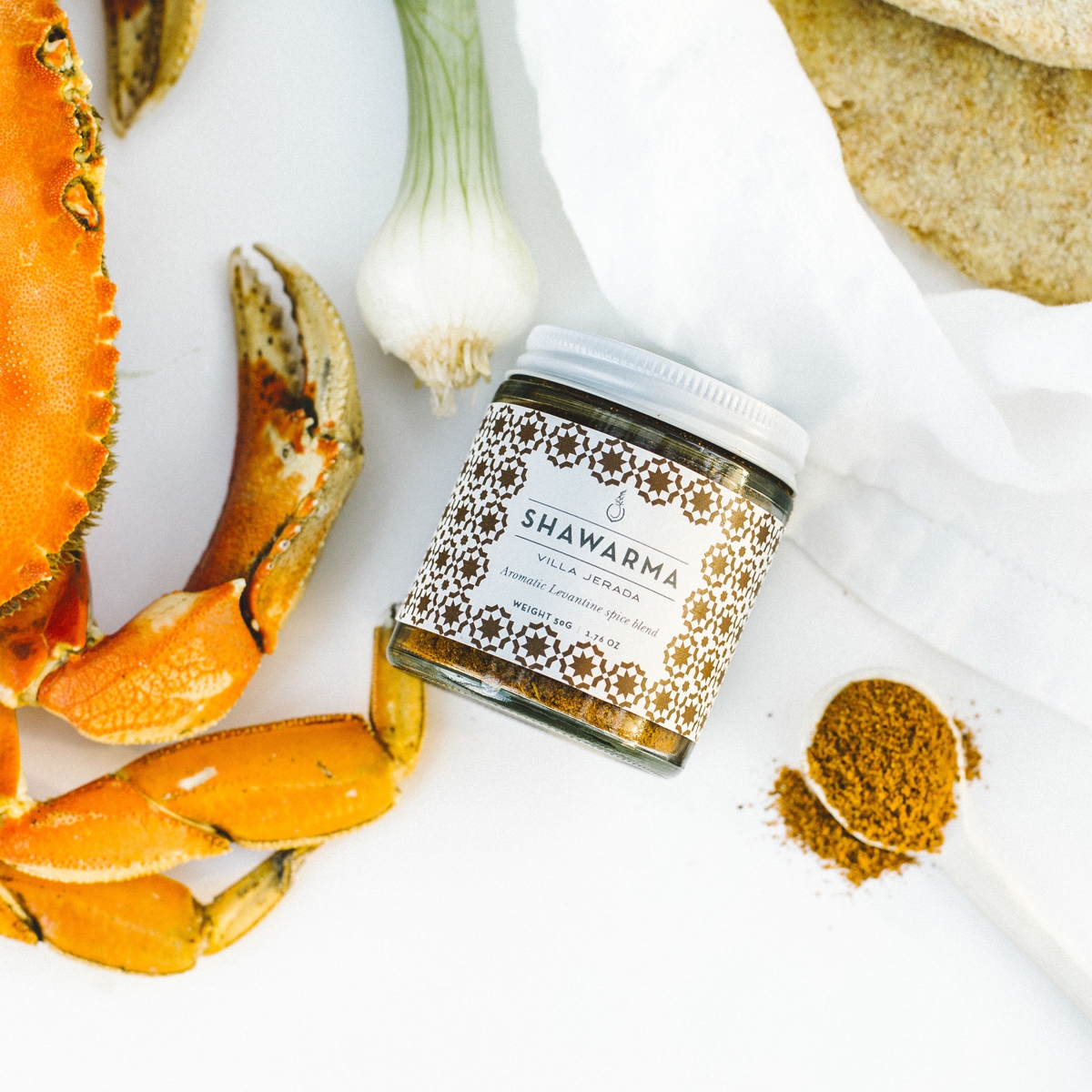 Jar of Villa Jerada Sharwarma next to a crab